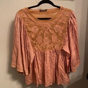Pink flowy top with beaded pattern